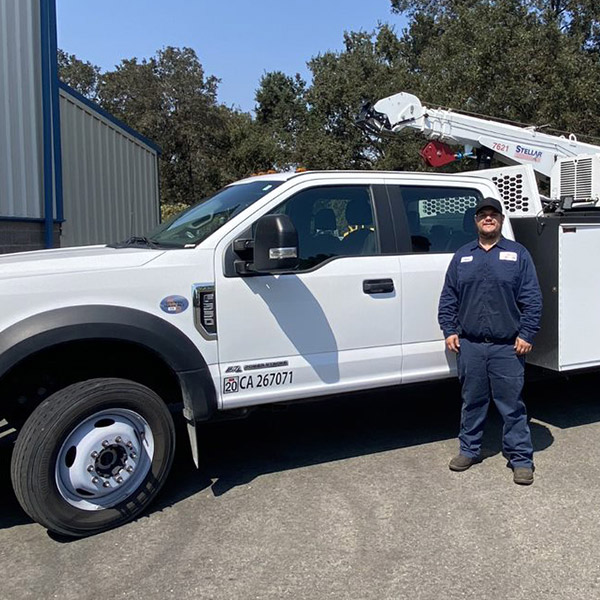guy standing in front of white machinery